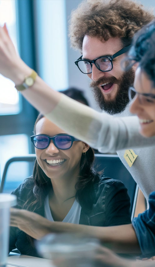 Diverse team of professionals celebrating a successful project